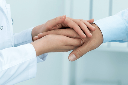 internal medicine doctor shaking patient's hand