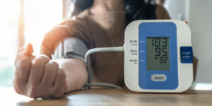 Hypertension or high blood pressure illness in patient with blood pressure monitoring, measurement on digital sphygmomanometer for self-check on health at home