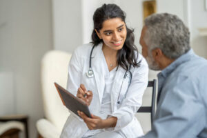 Primary care physician with Senior Man