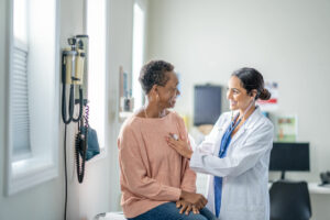 primary care physician ctalking to patient during check up